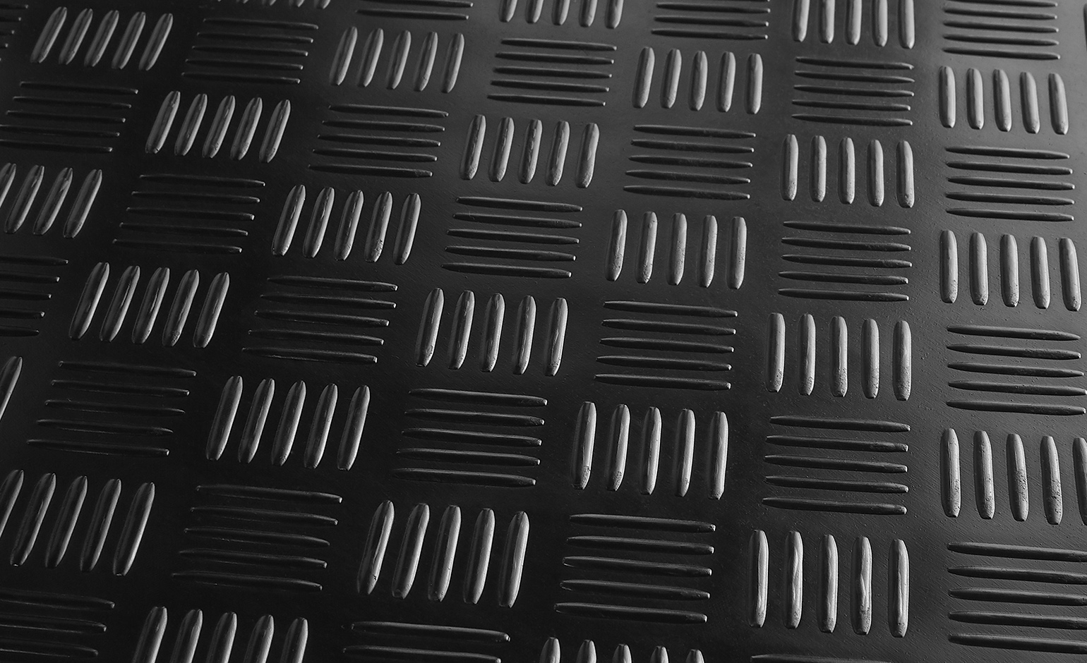 Sol vinyle CAOUTCHOUC CHECKER , coloris caoutchouc checker noir, rouleau 1.40 m
